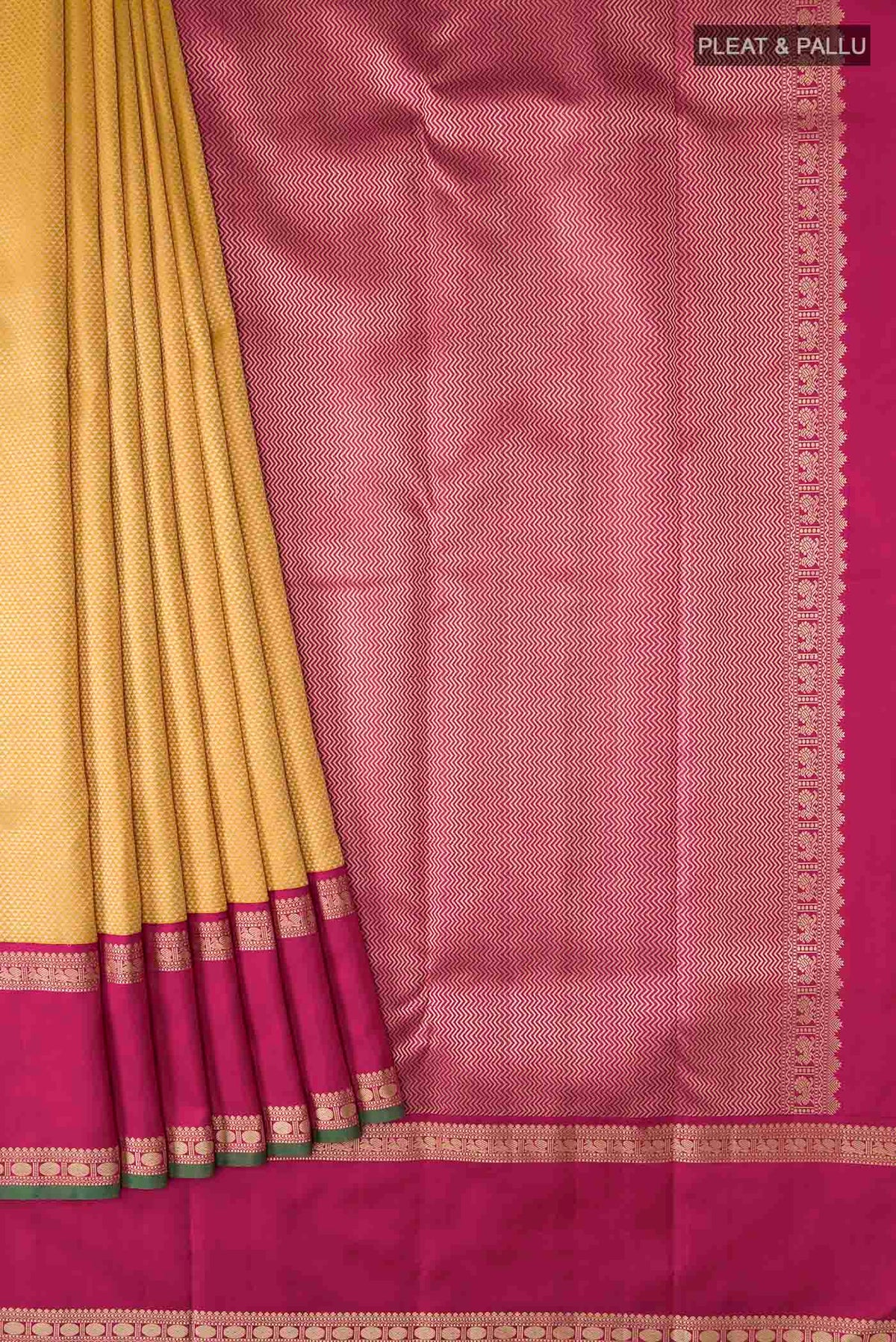 Pleats and pallu of Yellow Kanchipuram Silk Saree with Jacquard design on the body and Thread Border