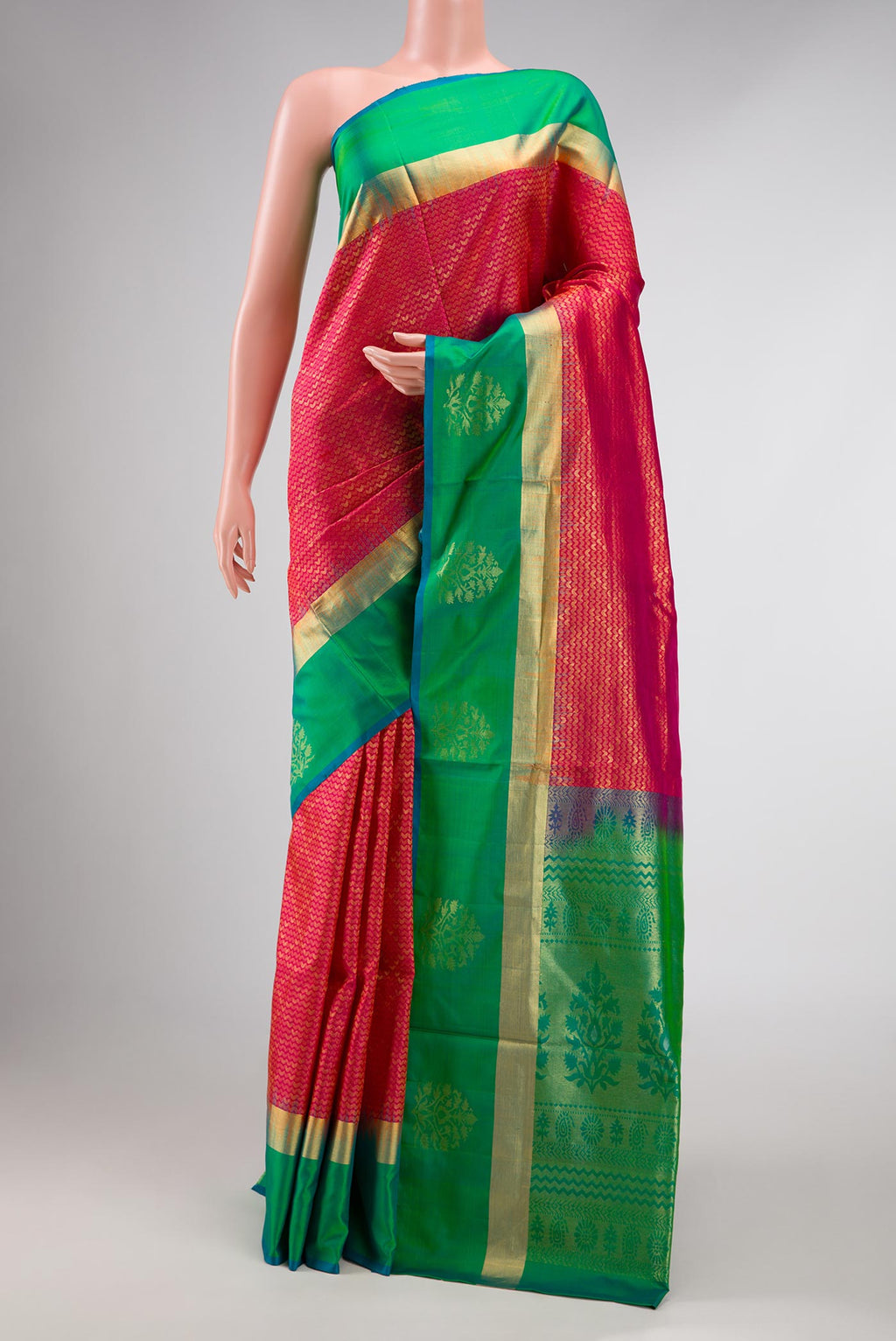 Red Dual Tone Soft Silk Saree with Zari Brocade on the body and Zari Border displayed on a mannequin