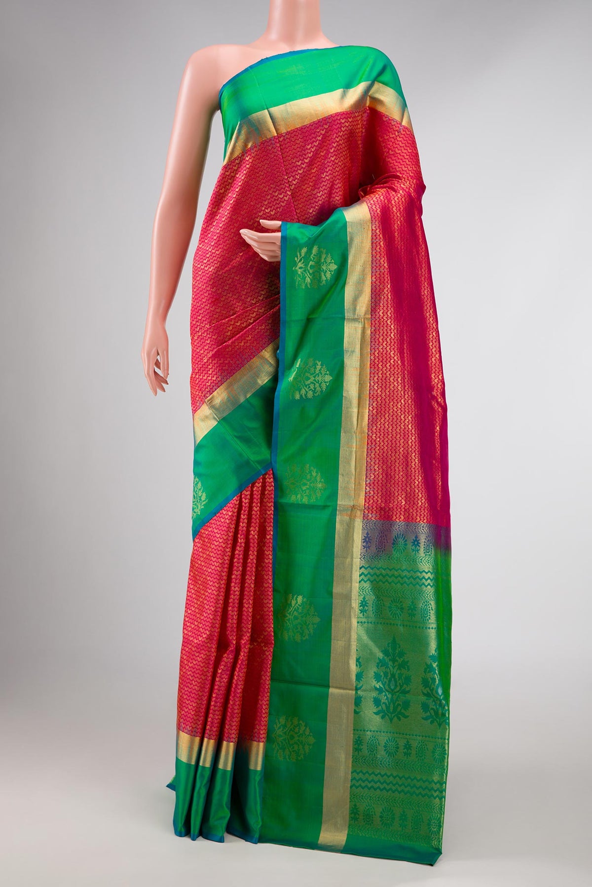 Red Dual Tone Soft Silk Saree with Zari Brocade on the body and Zari Border displayed on a mannequin