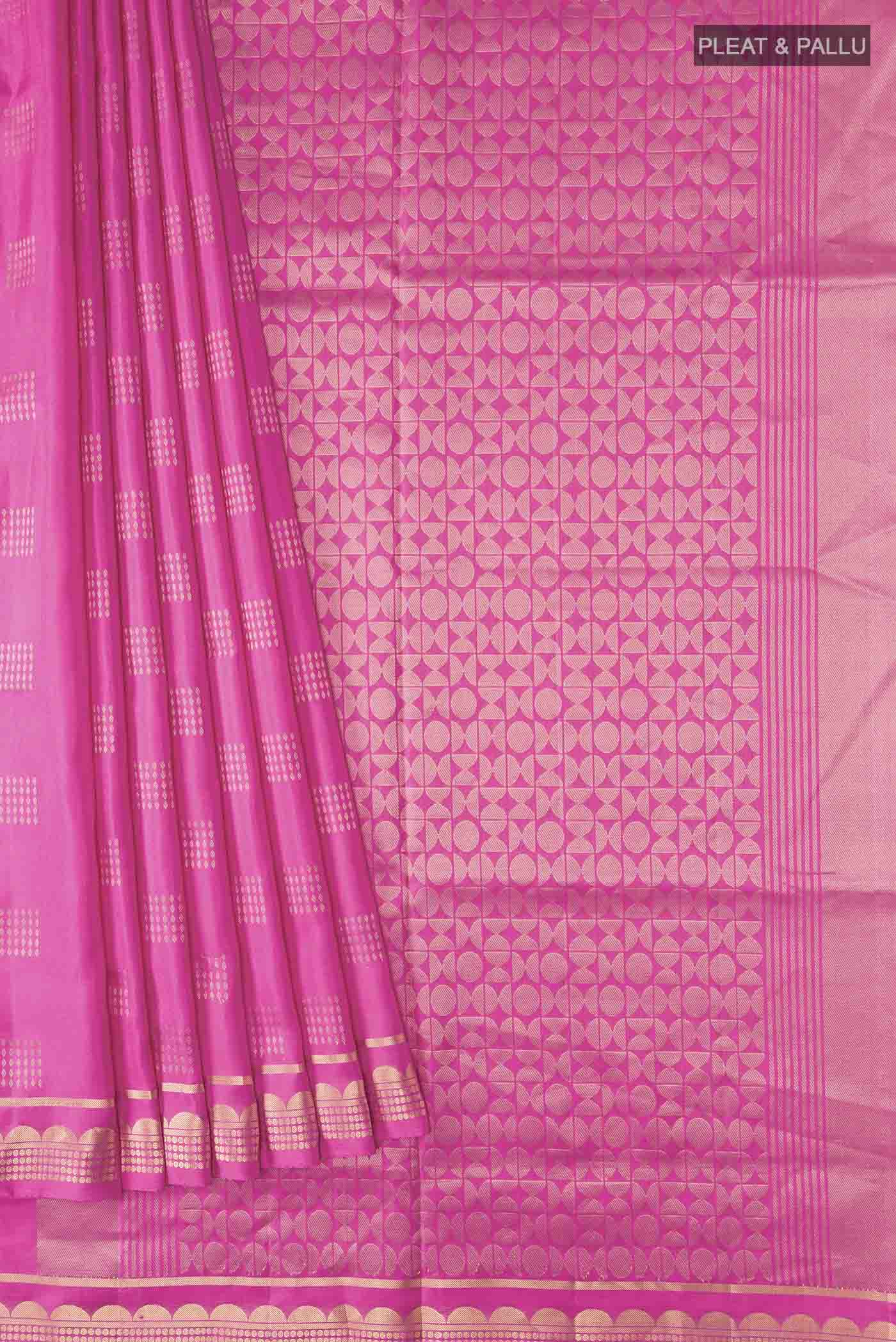 Pleats and pallu of Pink Soft Silk Saree with Zari Butta on the body and Zari Border