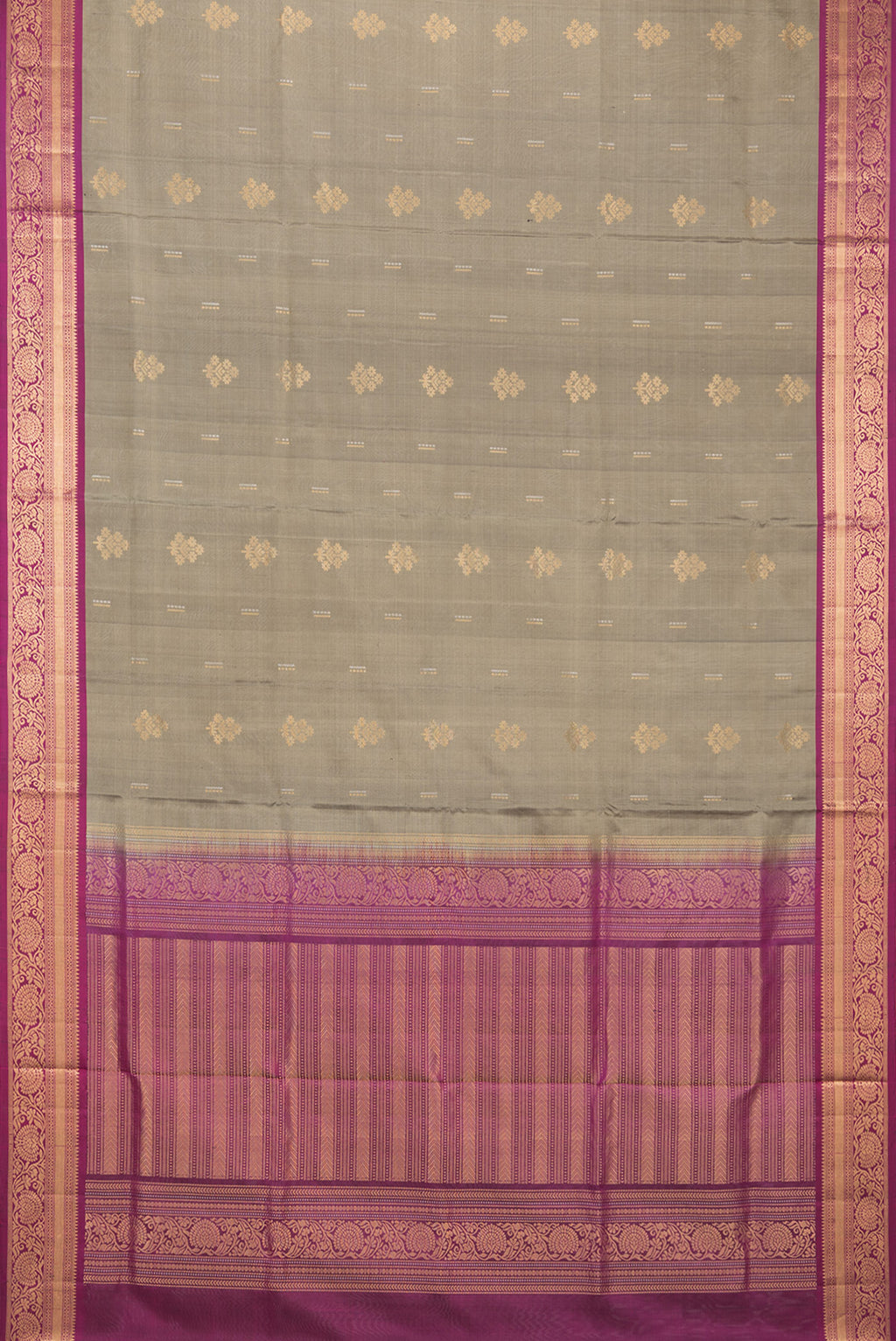 Flat view of Pure Silk Grey Soft Saree with Zari Butta on the body and Zari Border. 