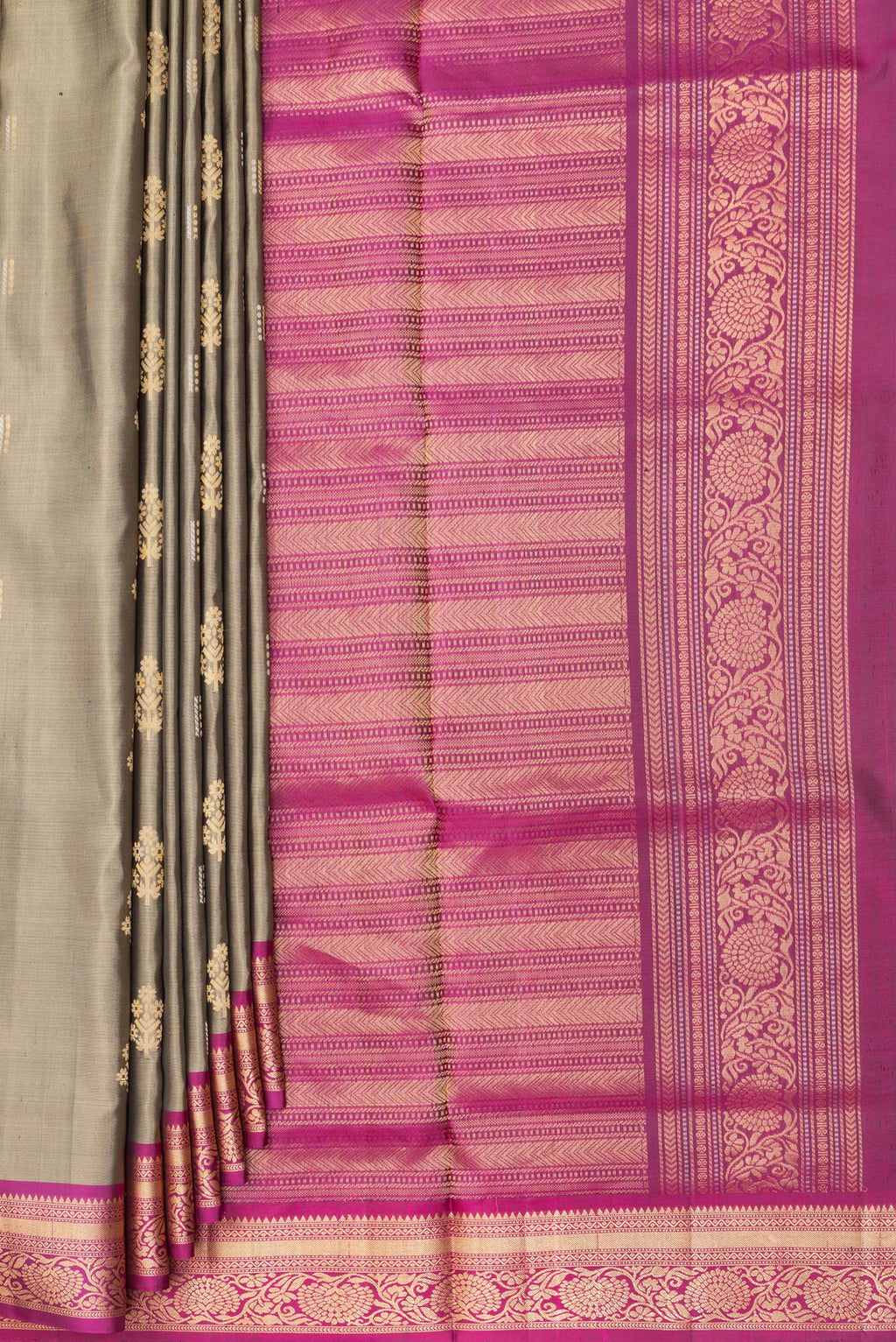 Pleats and pallu of Pure Silk Grey Soft Saree with Zari Butta on the body and Zari Border. 