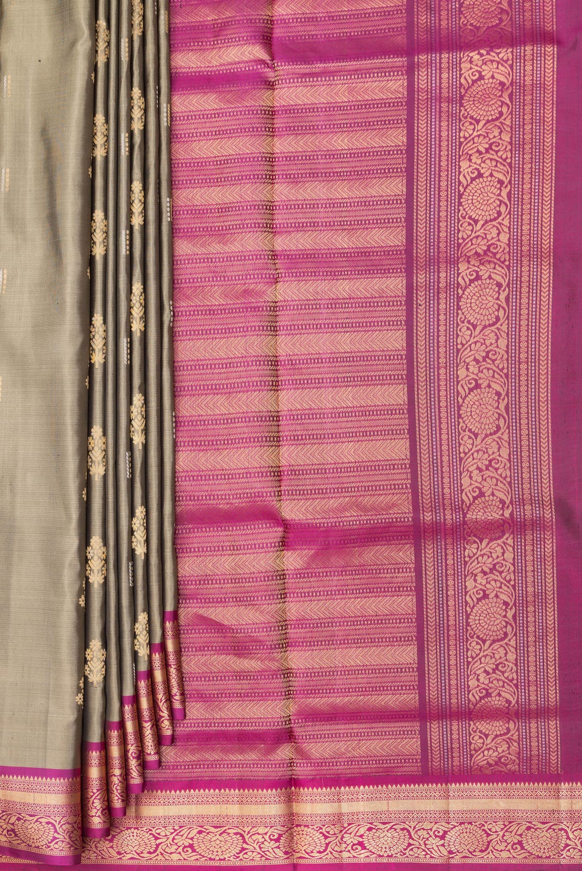 Pleats and pallu of Pure Silk Grey Soft Saree with Zari Butta on the body and Zari Border. 