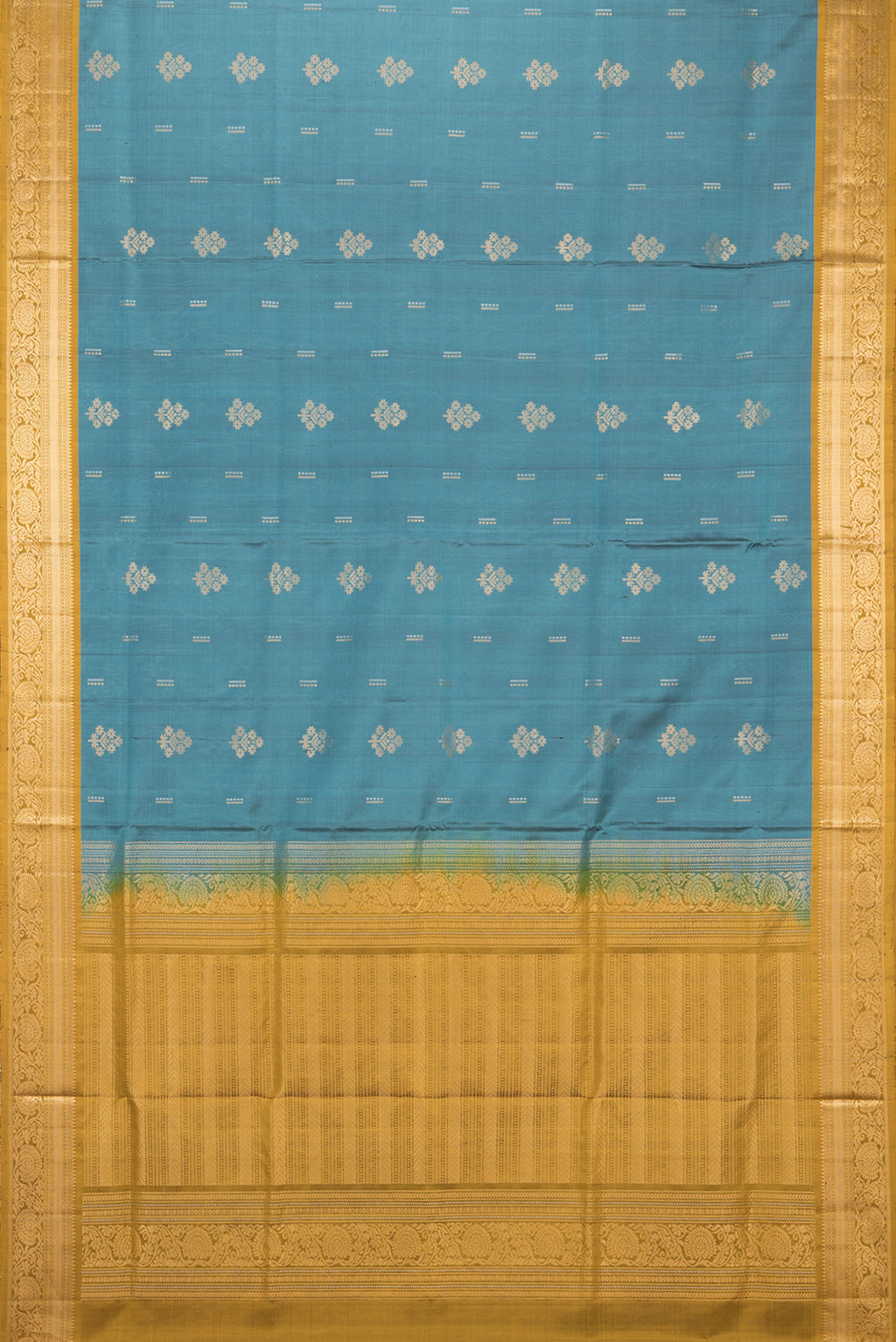 Flat view of Pure Silk Green Soft Saree with Zari Butta on the body and Zari Border. 
