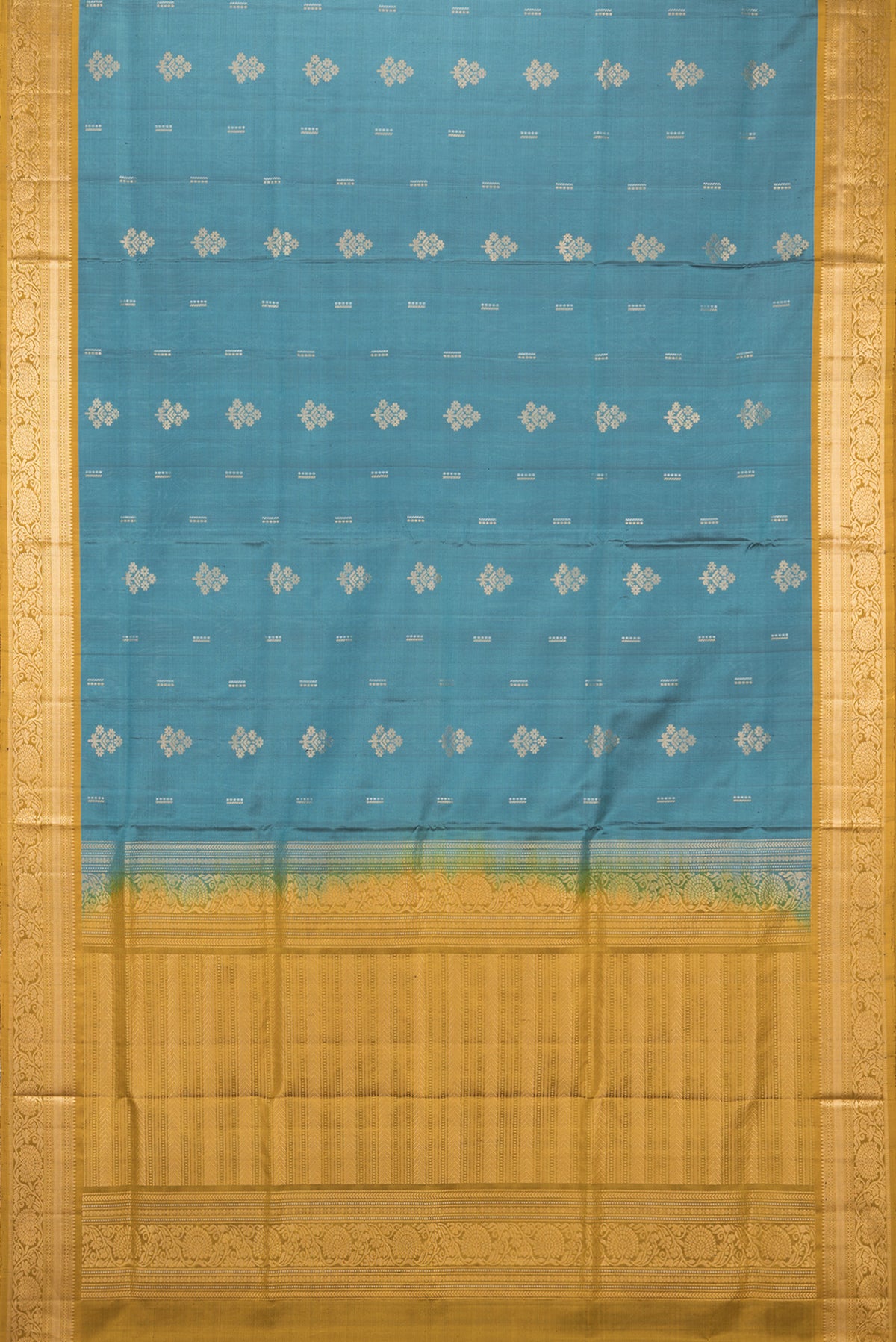 Flat view of Pure Silk Green Soft Saree with Zari Butta on the body and Zari Border. 