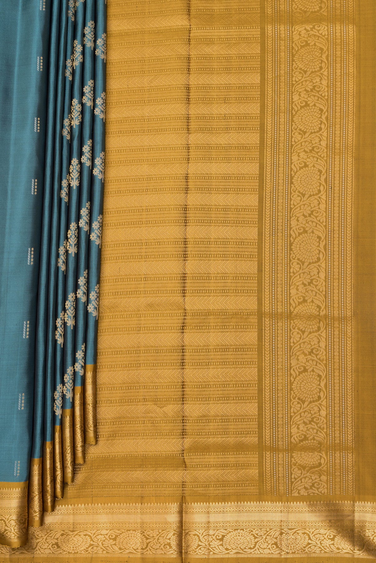 Pleats and pallu of Pure Silk Green Soft Saree with Zari Butta on the body and Zari Border. 