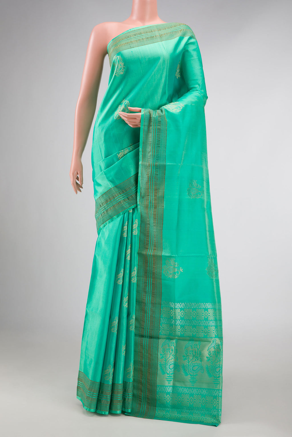 Sea Green Dual Tone Soft Silk Saree with Zari Butta on the body and Zari Border displayed on a mannequin