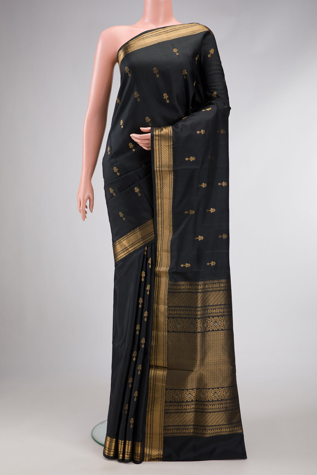 Black Dual Tone Soft Silk Saree with Zari Butta on the body and Zari Border.  displayed on a mannequin