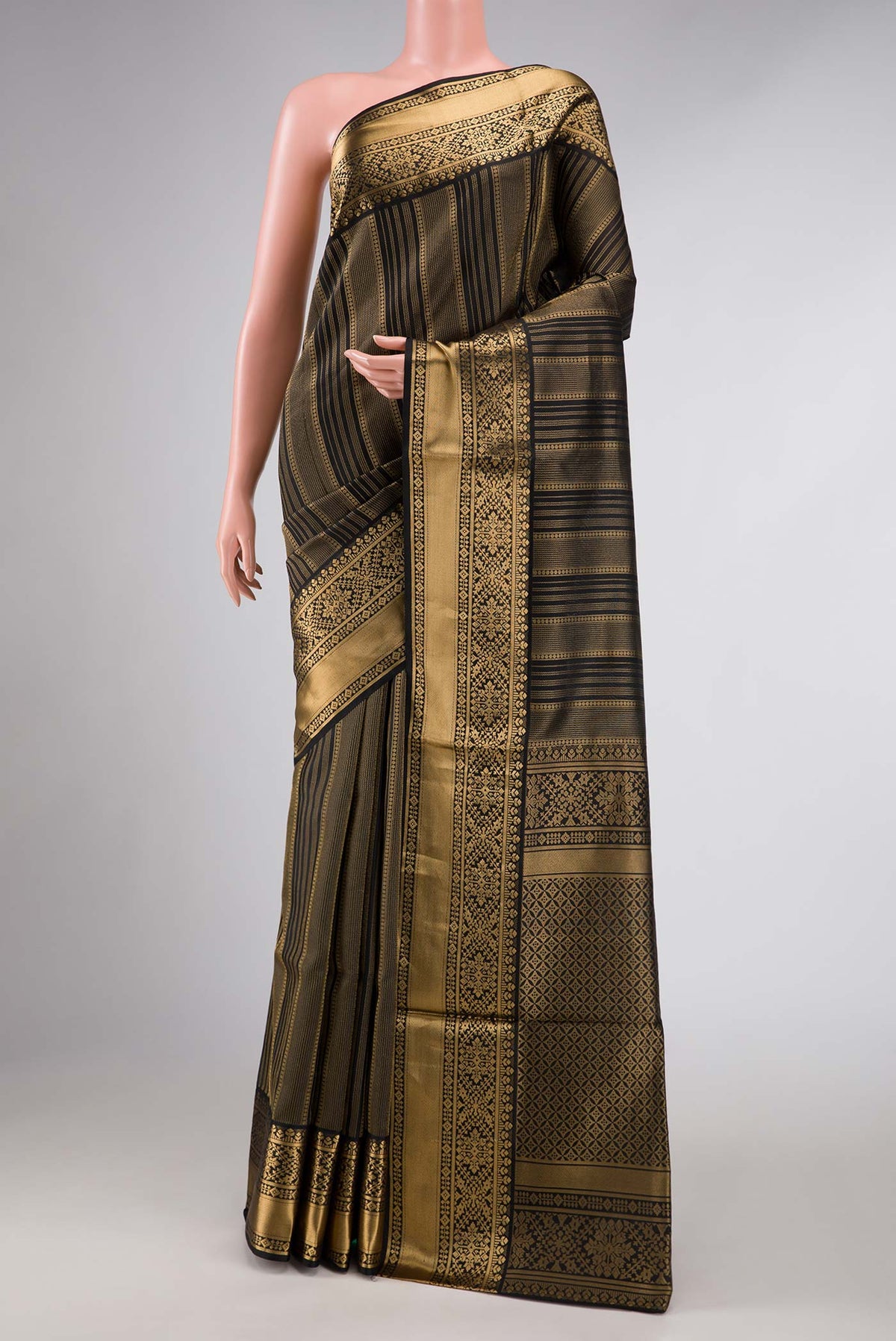 Black Dual Tone Soft Silk Saree with Stripes on the body and Zari Border displayed on a mannequin