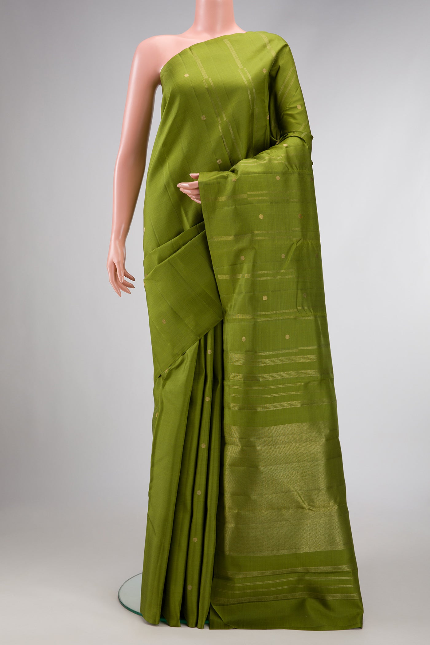 Pure Silk Pure Zari Green Dual Tone Kanjivaram Saree with Zari Butta on the body and Without Border.  displayed on a mannequin