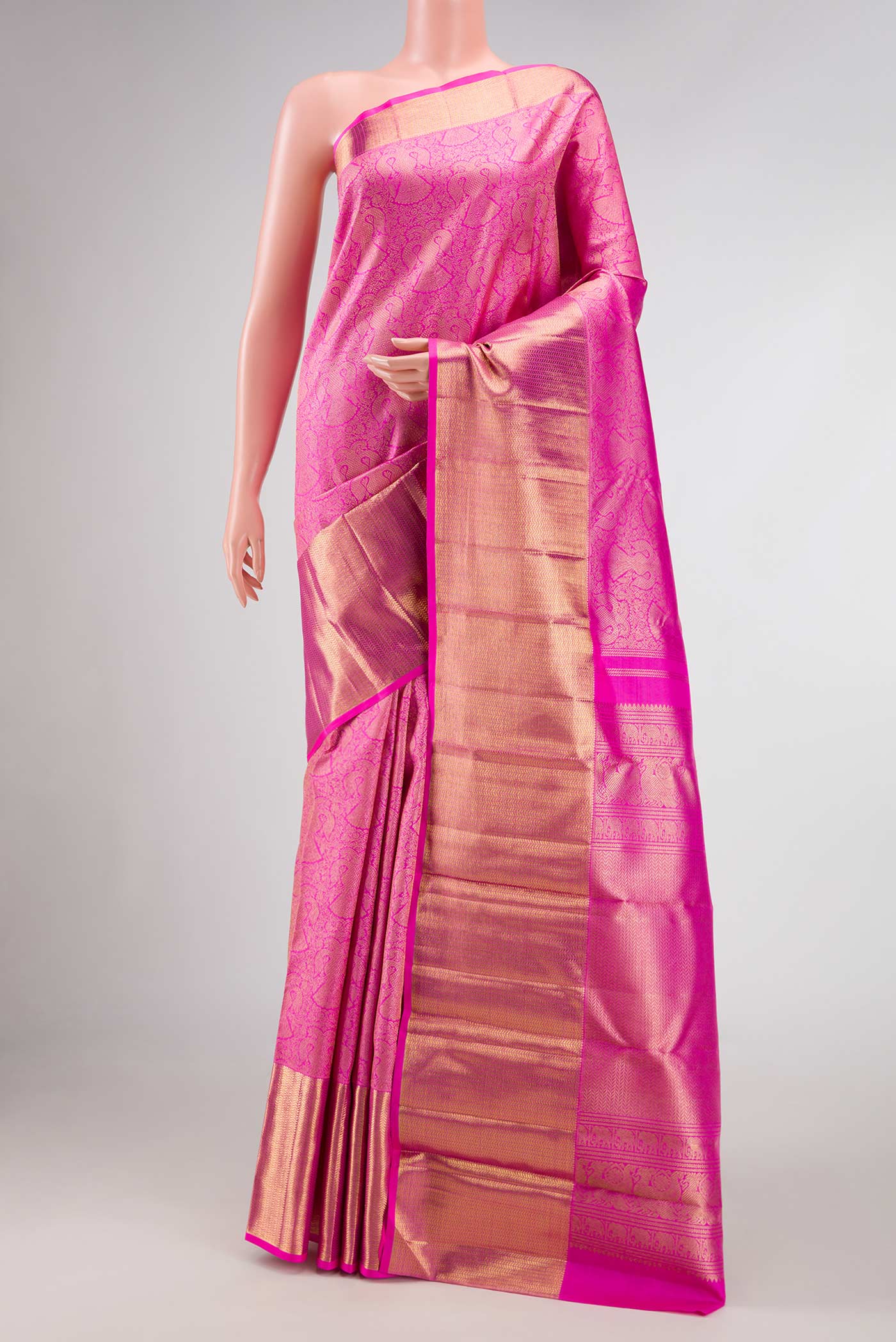 Pure Silk Pure Zari Pink Dual Tone Kanjivaram Saree with Zari Brocade on the body and Zari Border.  displayed on a mannequin