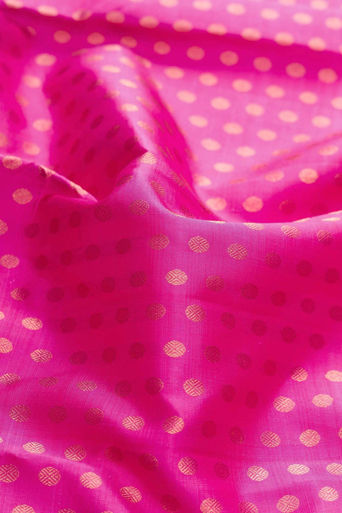 Close up of Pure Silk Pure Zari Pink Dual Tone Kanchipuram Saree with Zari Brocade on the body and Zari Border displaying folds