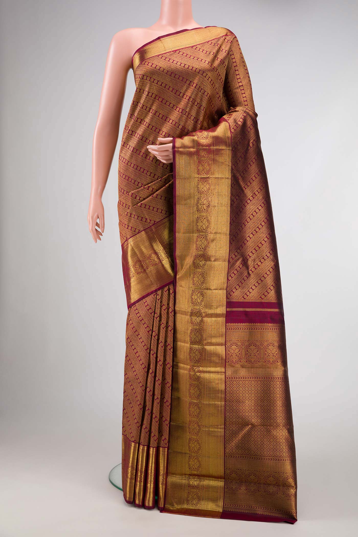 Pure Silk Pure Zari Maroon Dual Tone Kanjivaram Saree with Zari Brocade on the body and Zari Border.  displayed on a mannequin