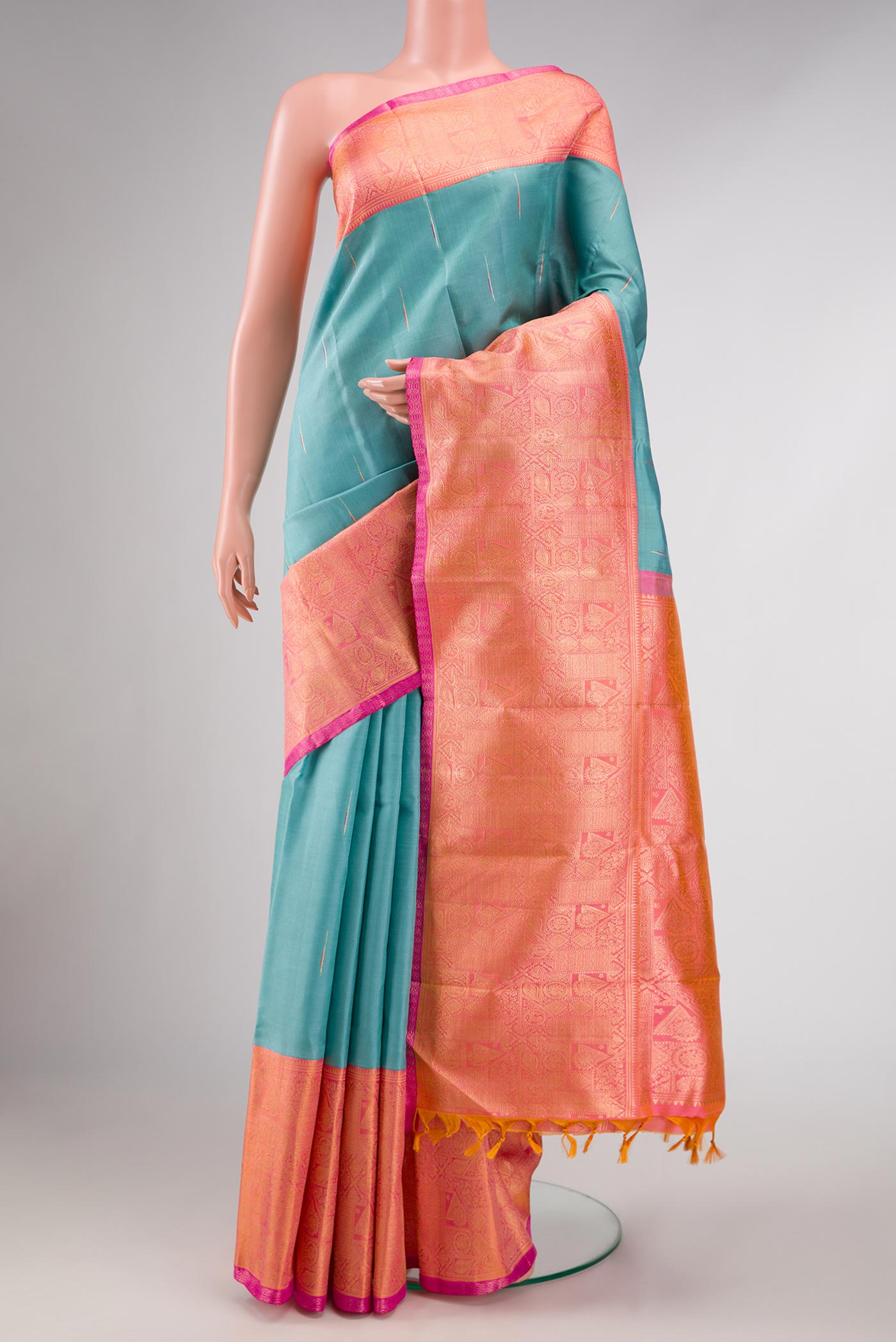 Blue Grey Dual Tone Kanchipuram Silk Saree with Zari Butta on the body and Zari Border displayed on a mannequin