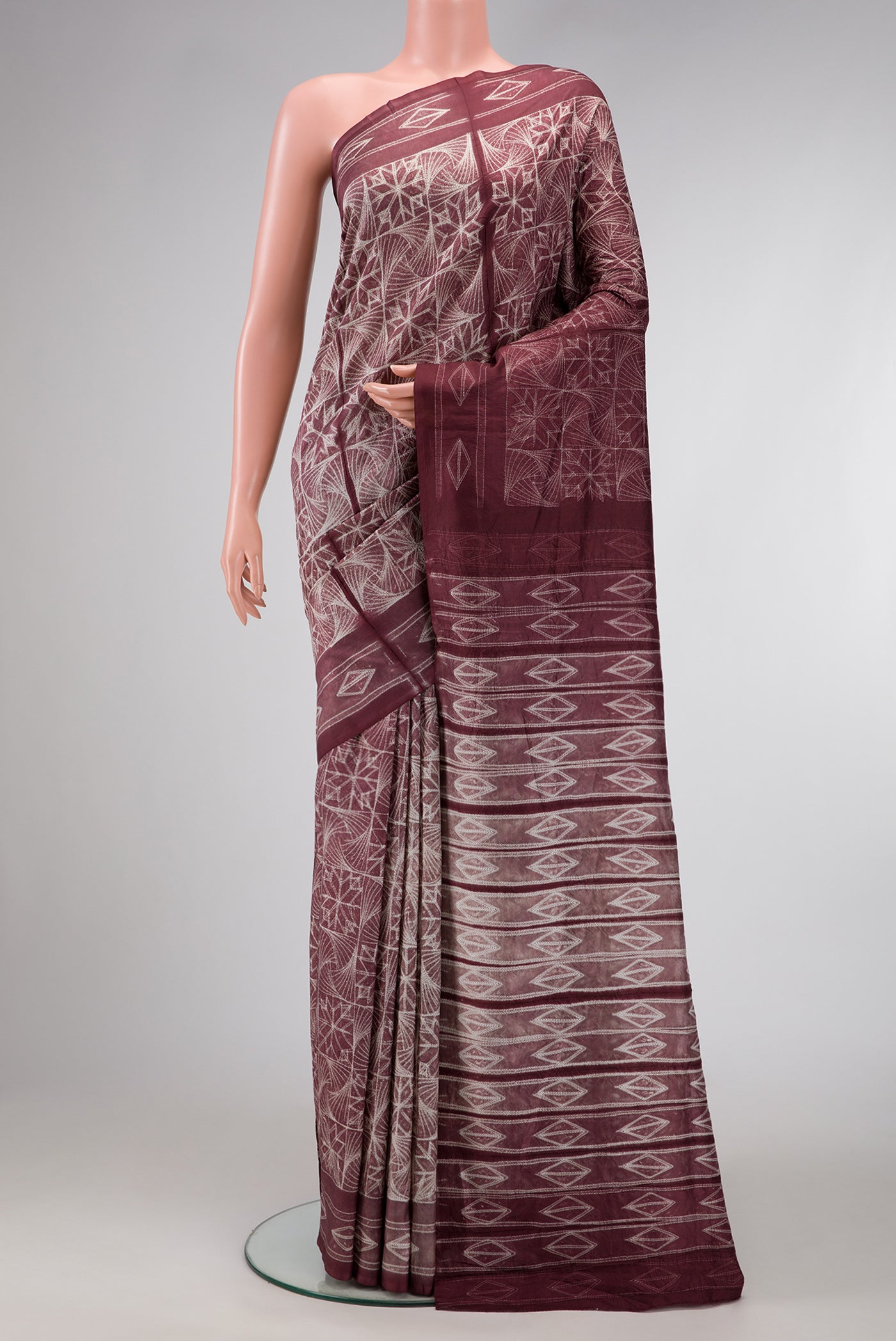 Brown Dual Tone Tussar Silk Saree with Printed design on the body and Printed Border.  displayed on a mannequin