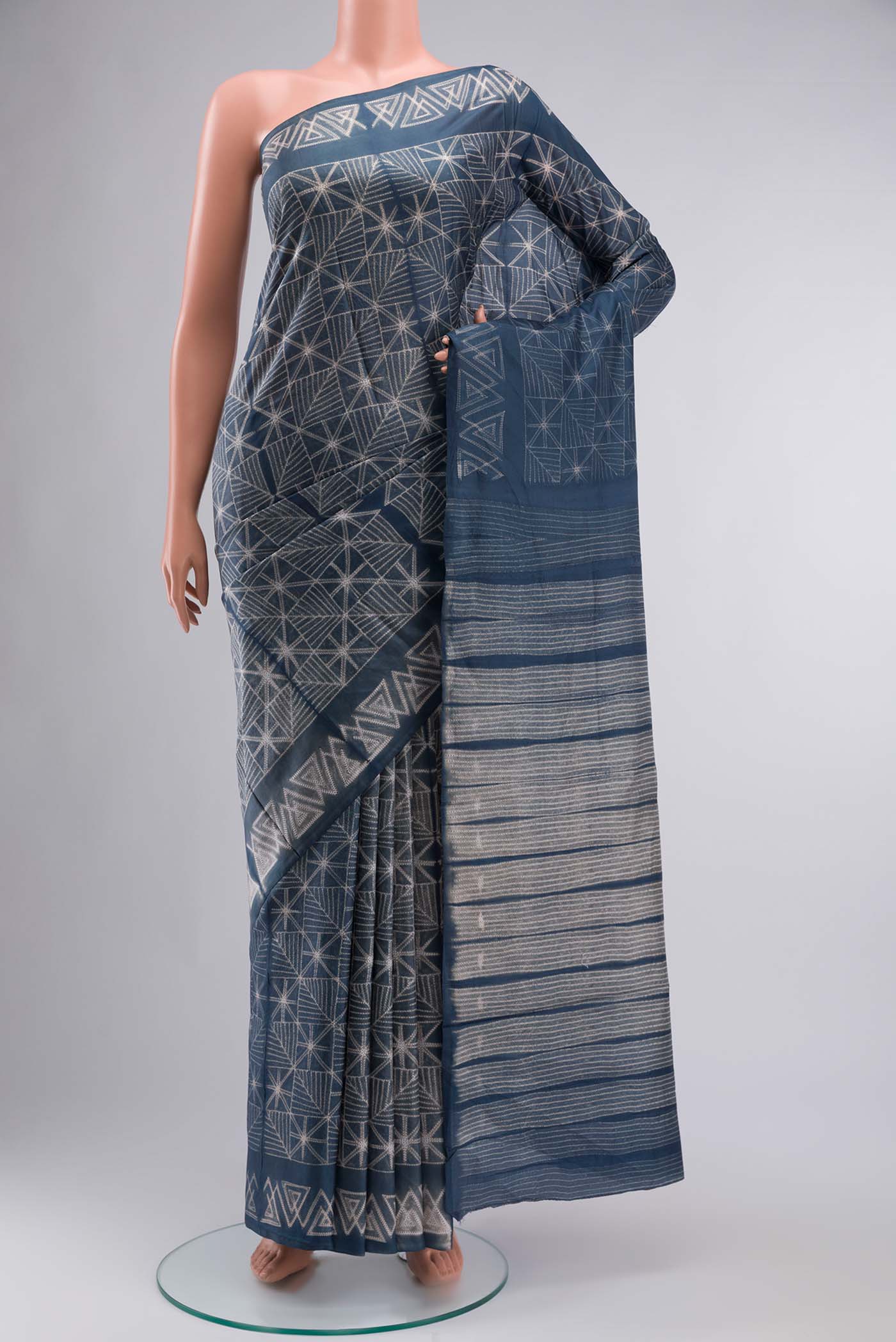 Blue Grey Printed Silk SareePrinted design on the body and Printed Border displayed on a mannequin