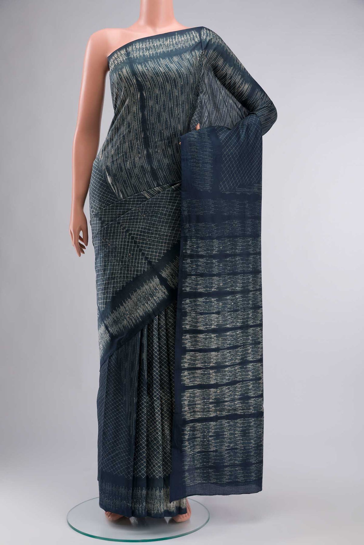 Grey Printed Silk SareePrinted design on the body and Printed Border displayed on a mannequin