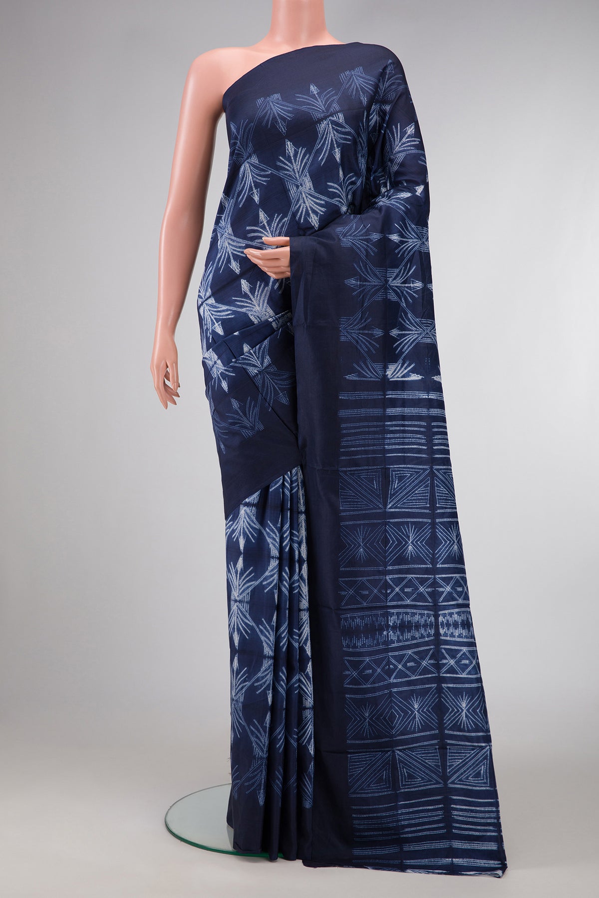 Navy Blue Dual Tone Tussar Silk Saree with Printed design on the body and Plain Border.  displayed on a mannequin