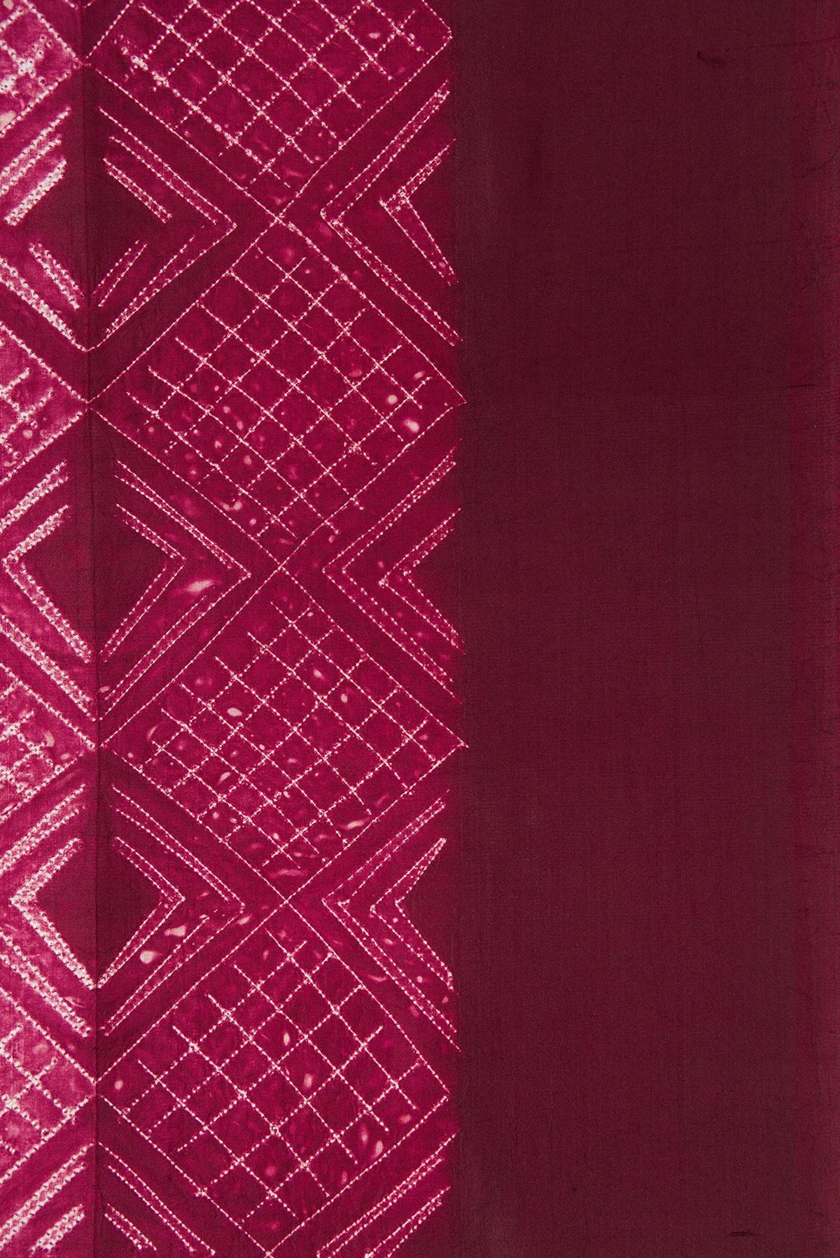 Border image of Maroon Dual Tone Tussar Silk Saree with Printed design on the body and Plain Border. 