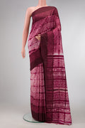 Maroon Dual Tone Tussar Silk Saree with Printed design on the body and Plain Border.  displayed on a mannequin
