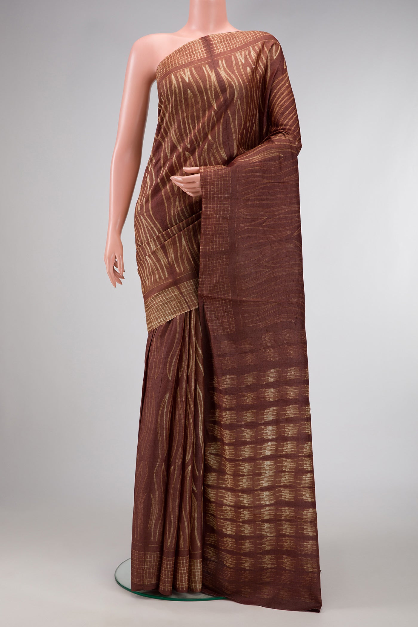 Brown Dual Tone Tussar Silk Saree with Printed design on the body and Printed Border.  displayed on a mannequin