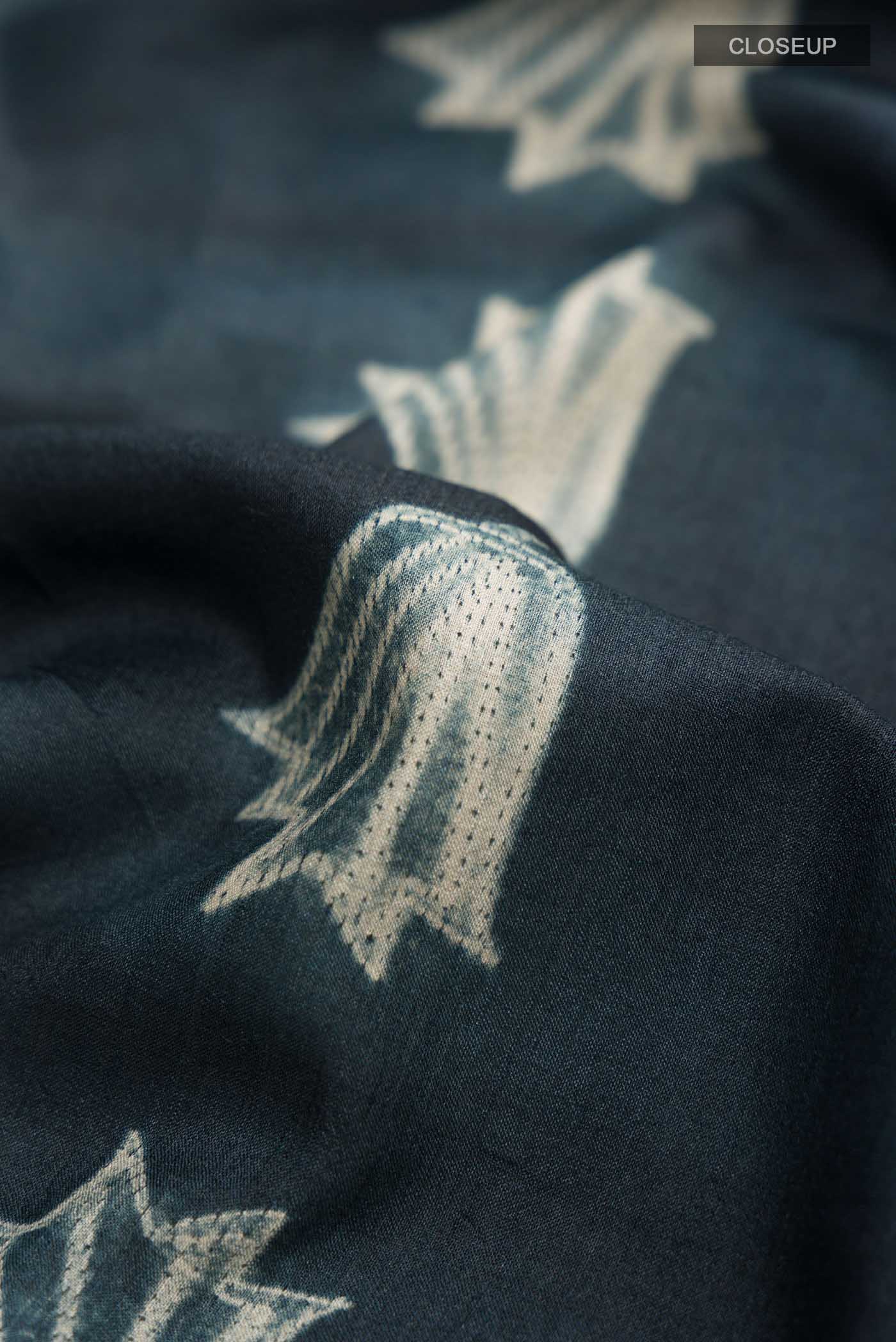 Close up of Grey Bhagalpuri Tussar Silk SareePrinted design on the body and Printed Border displaying folds