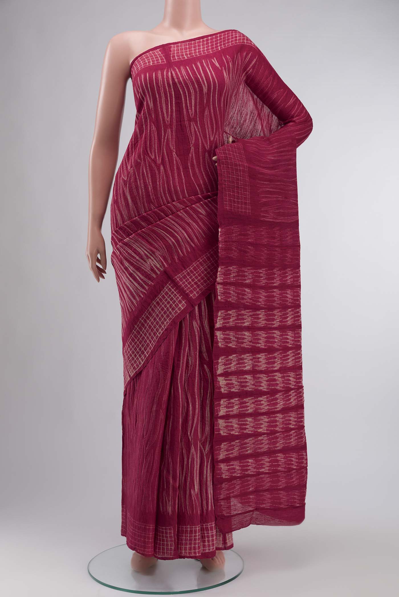 Maroon Tussar Silk Saree Printed design on the body and Without Border displayed on a mannequin