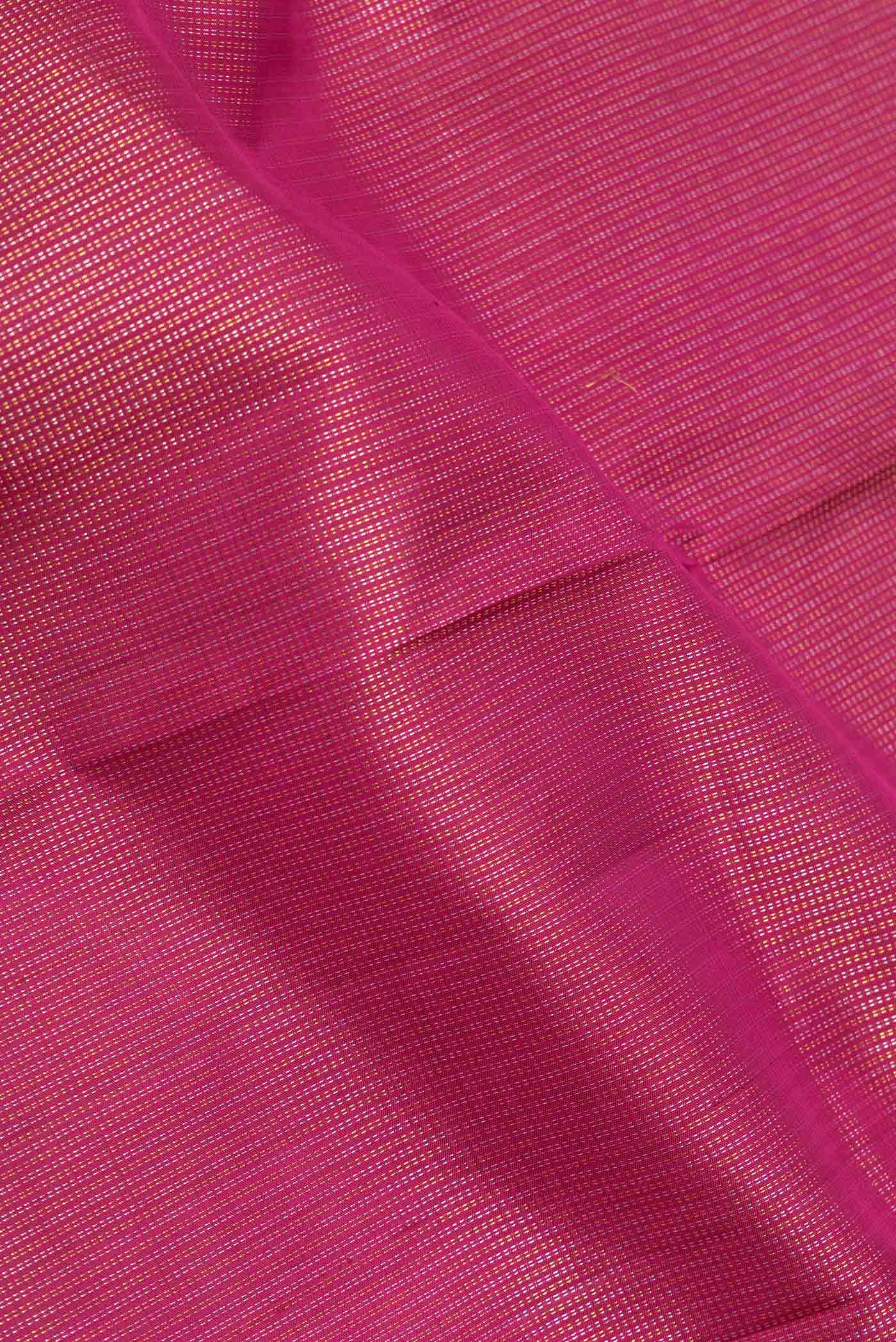 Close up of Pink Dual Tone Kanchipuram Silk Saree with Zari Brocade on the body and Zari Border displaying folds