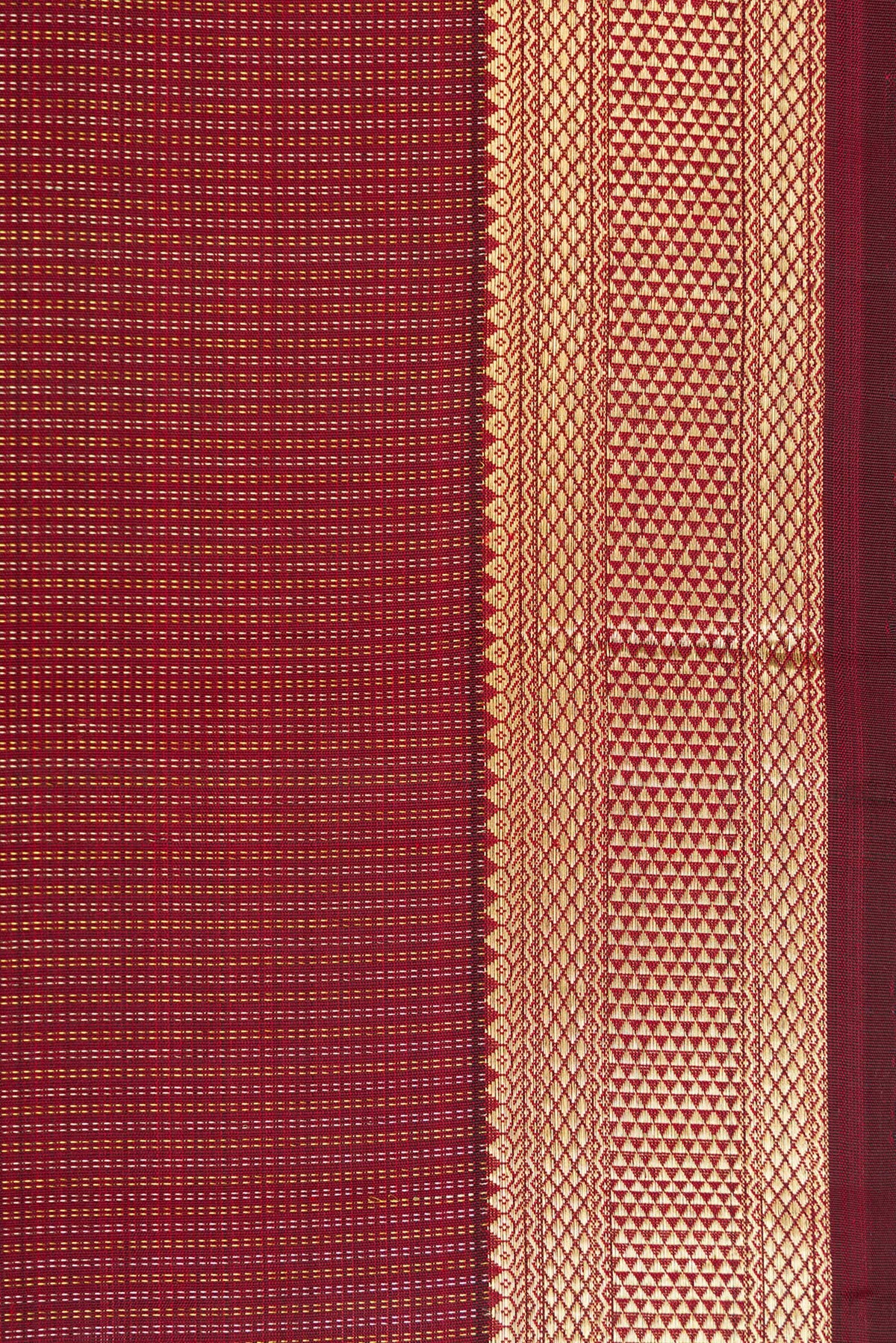 Border image of Maroon Dual Tone Kanchipuram Silk Saree with Stripes on the body and Zari Border. 