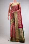 Magenta Dual Tone Kanjivaram Silk Saree with Zari Brocade on the body and Zari Border.  displayed on a mannequin