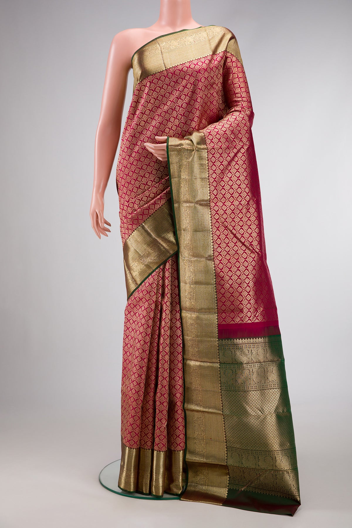 Magenta Dual Tone Kanjivaram Silk Saree with Zari Brocade on the body and Zari Border.  displayed on a mannequin