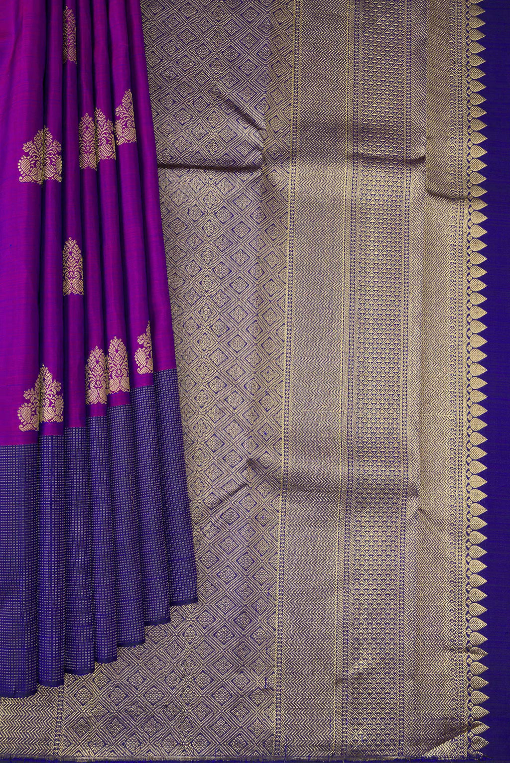 Pleats and pallu of Purple Kanjivaram Silk Saree with Zari Butta on the body and Fancy Border. 