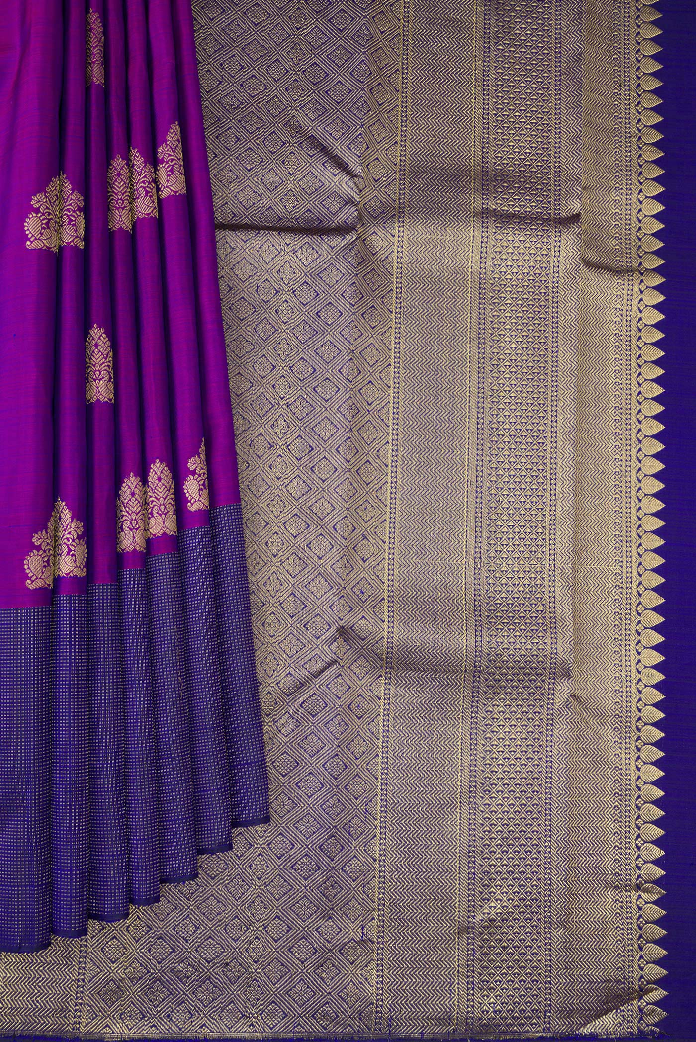 Pleats and pallu of Purple Kanjivaram Silk Saree with Zari Butta on the body and Fancy Border. 
