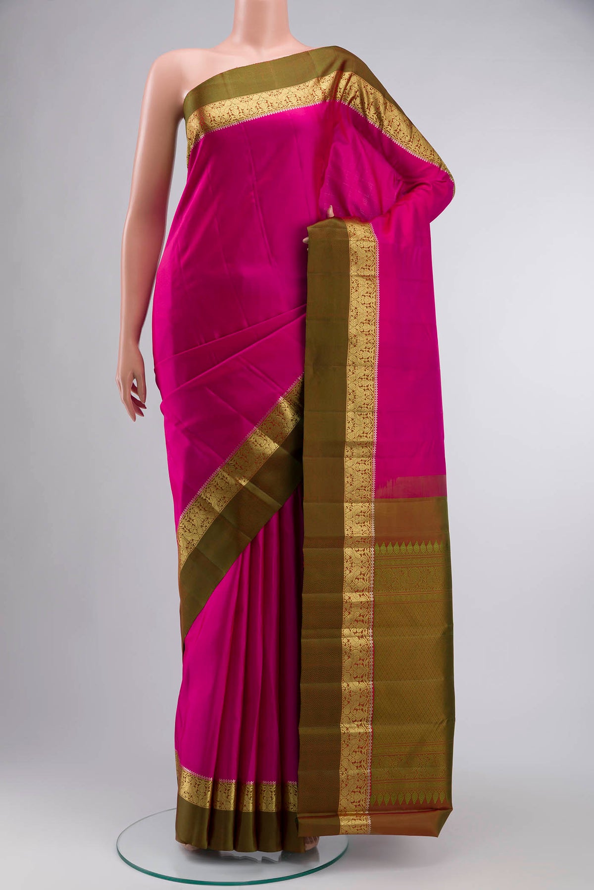 Pink Kanchipuram Silk Saree with Plain Body and Zari Border displayed on a mannequin