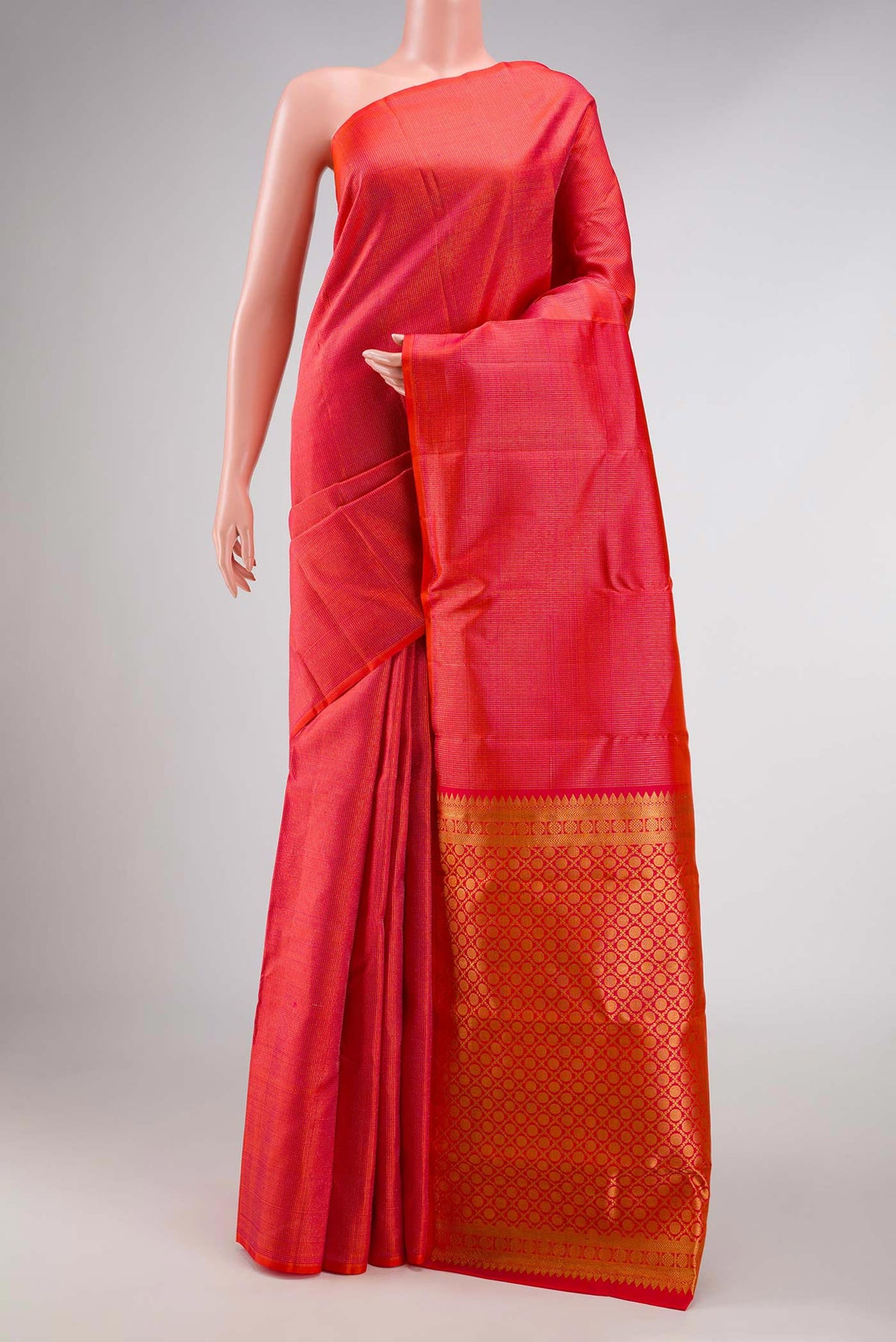 Coral Dual Tone Kanchipuram Silk Saree with Zari Brocade on the body and Without Border displayed on a mannequin