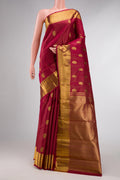 Pure Silk Pure Zari Red Dual Tone Kanchipuram Saree with Zari Butta on the body and Zari Border displayed on a mannequin