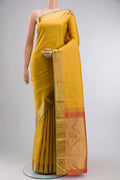 Yellow Kanchipuram Silk Saree with Jacquard design on the body and Zari Border displayed on a mannequin