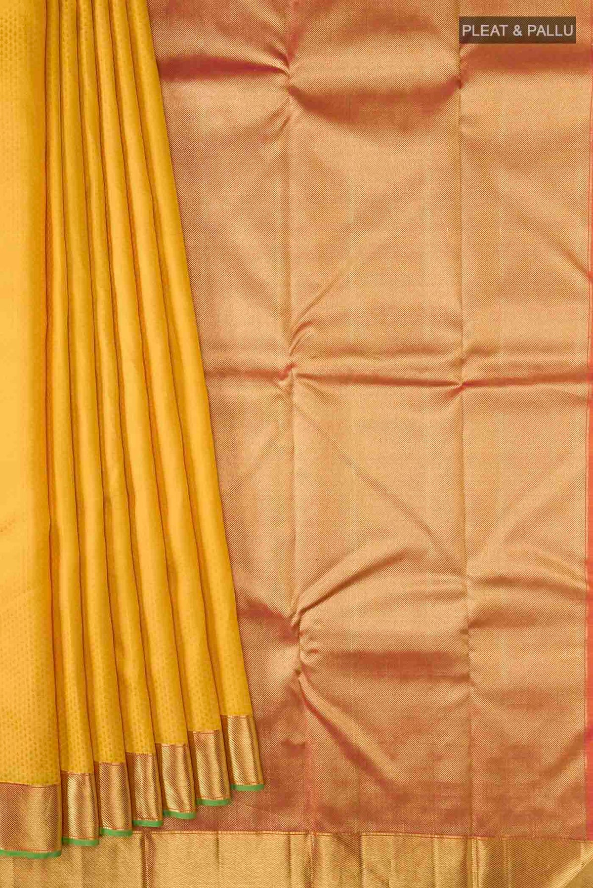 Pleats and pallu of Yellow Kanchipuram Silk Saree with Jacquard design on the body and Zari Border