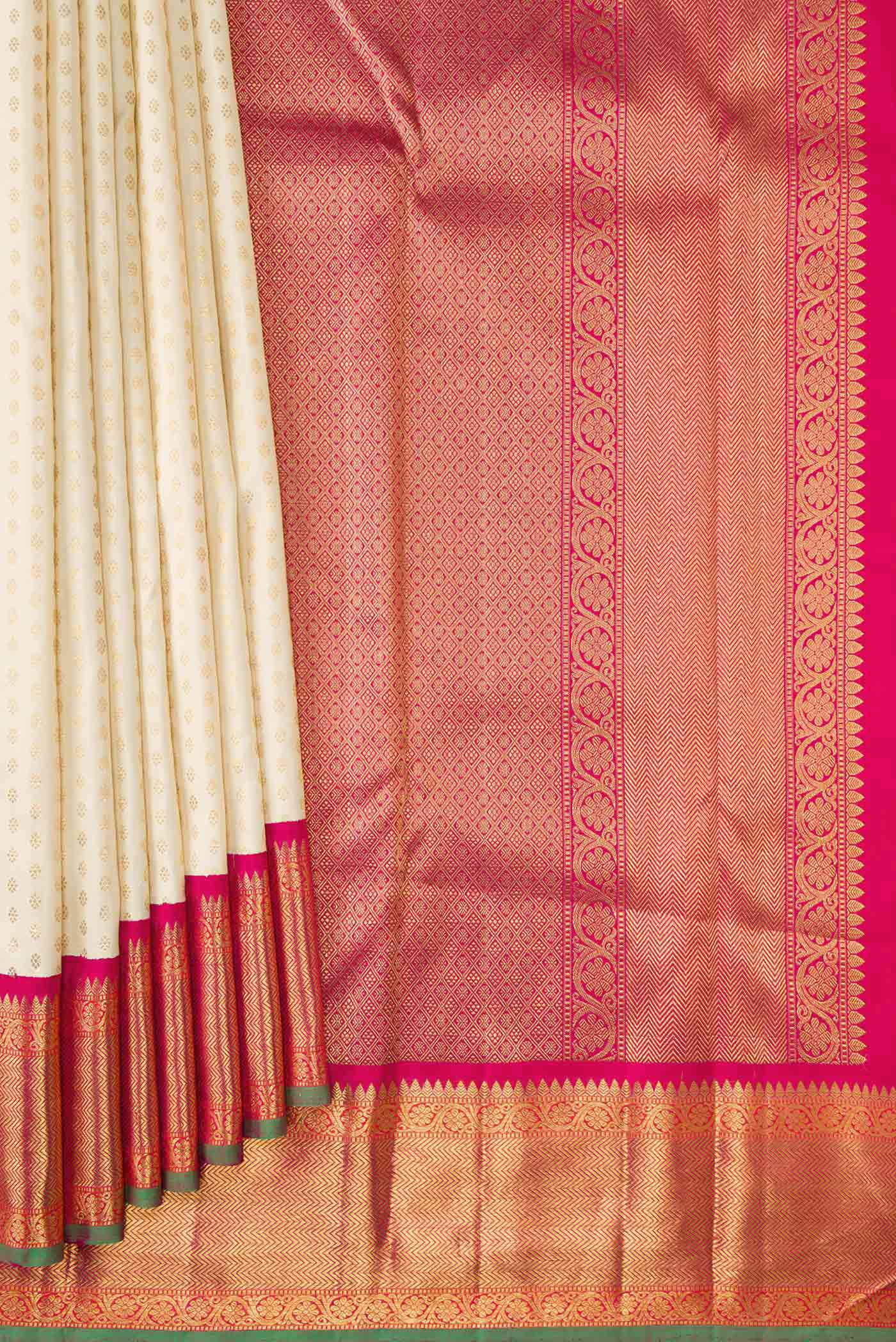 Pleats and pallu of Off White Dual Tone Kanchipuram Silk Saree with Zari Brocade on the body and Zari Border