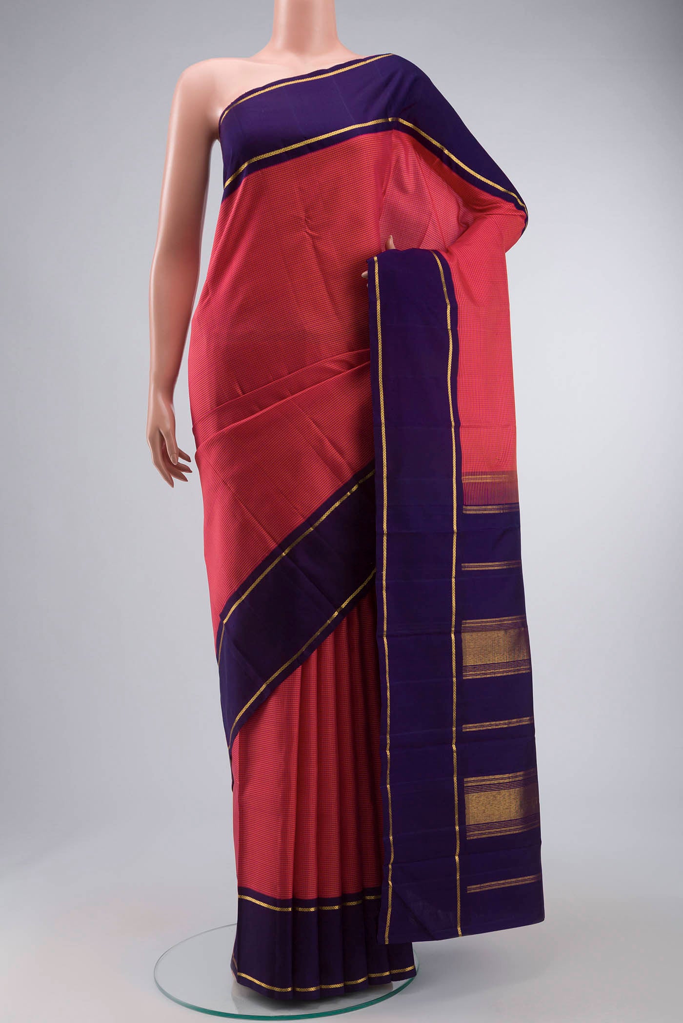 Pink Kanchipuram Silk Saree with Checked design on the body and Zari Border displayed on a mannequin
