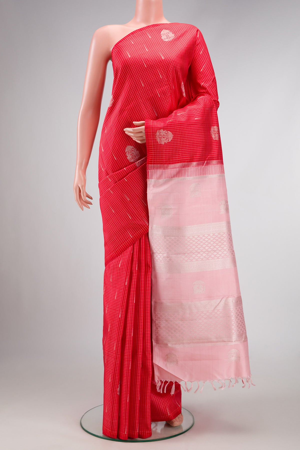 Pure Silk Pure Zari Red Dual Tone Kanjivaram Saree with Zari Butta on the body and Without Border.  displayed on a mannequin
