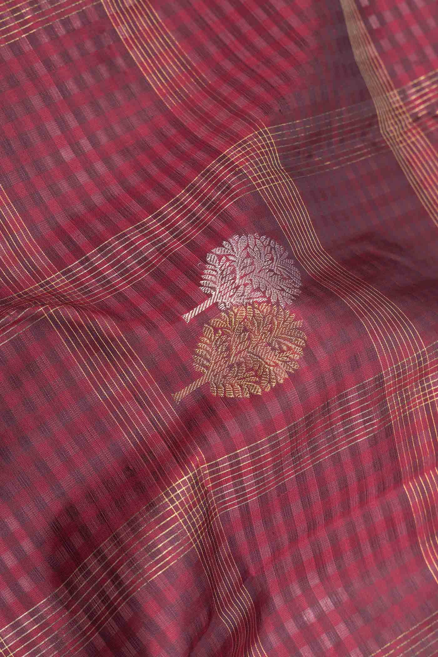Close up of Maroon Dual Tone Kanchipuram Saree with Checked design on the body and Without Border displaying folds
