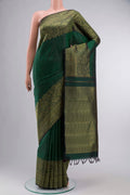 Green Kanchipuram Silk Saree with Jacquard design on the body and Zari Border displayed on a mannequin