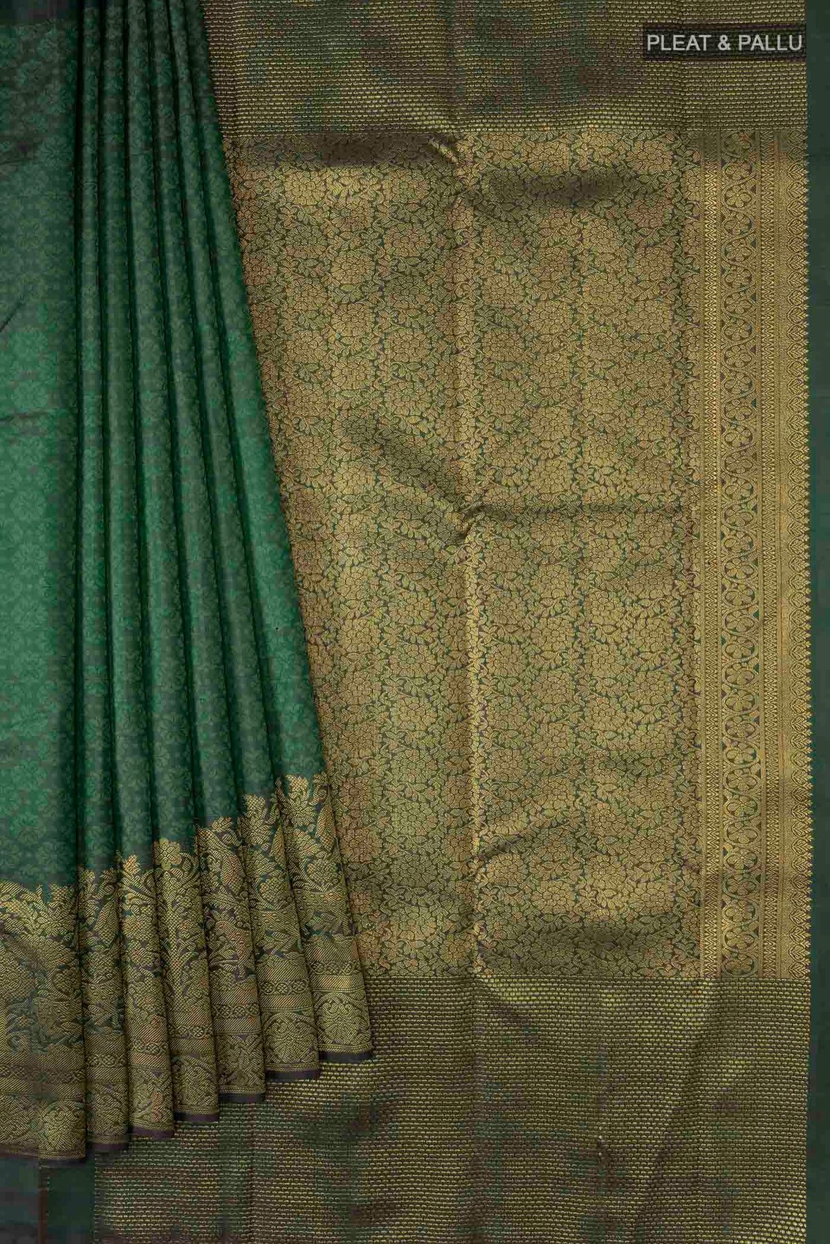 Pleats and pallu of Green Kanchipuram Silk Saree with Jacquard design on the body and Zari Border