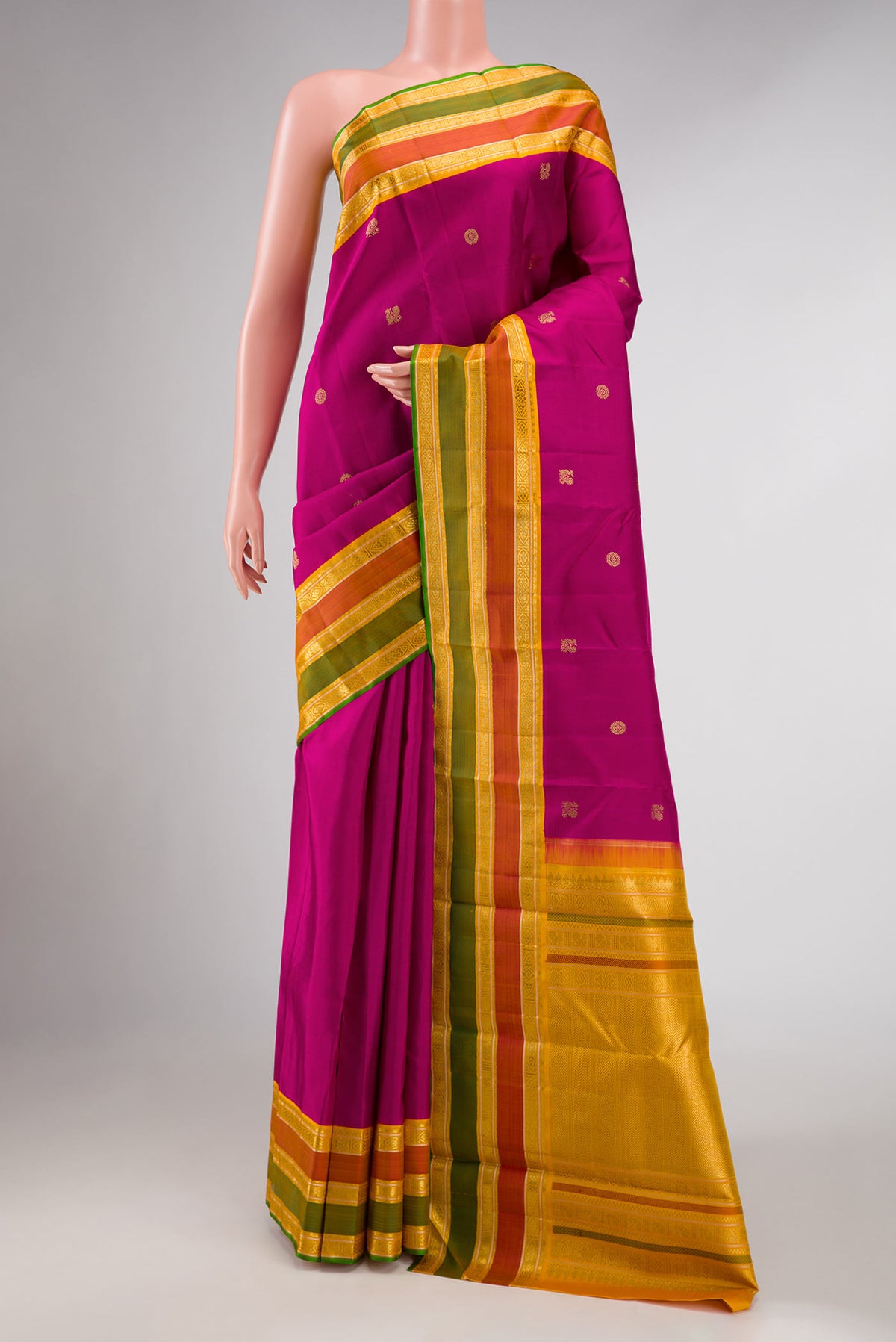 Pure Silk Pure Zari Magenta Dual Tone Kanchipuram Saree with Zari Butta on the body and Zari Border displayed on a mannequin