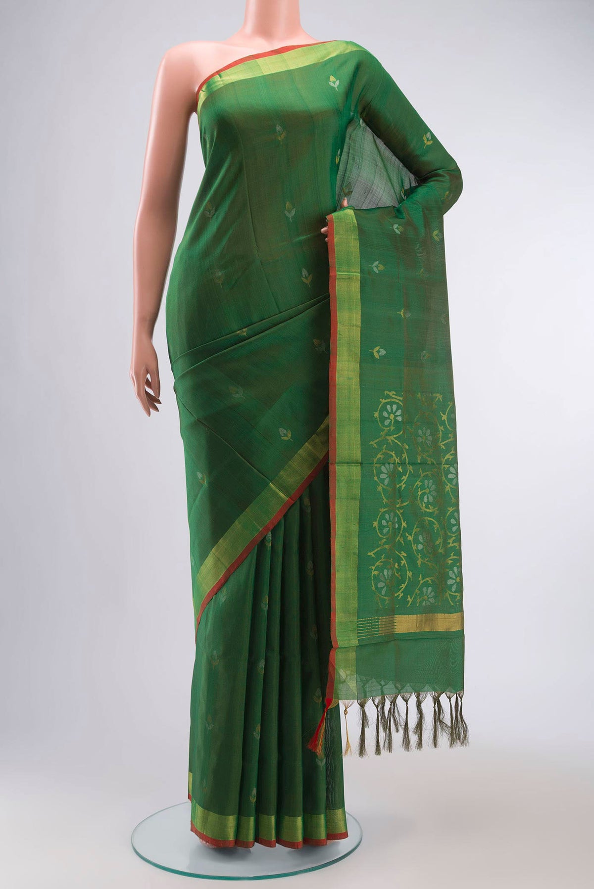 Green Uppada Silk Saree with Zari Butta on the body and Zari Border displayed on a mannequin