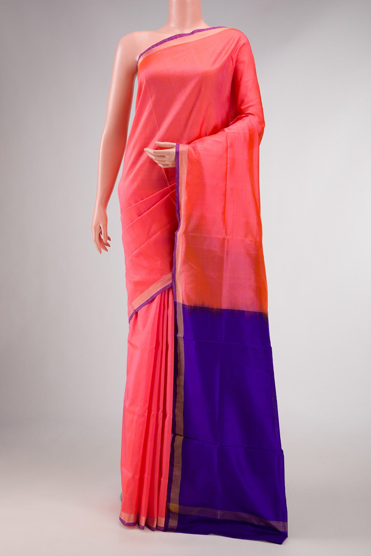 Coral Dual Tone Uppada Silk Saree with Plain Body and Zari Border displayed on a mannequin