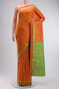 Orange Kanchipuram Silk Saree with Plain Body and Zari Border displayed on a mannequin