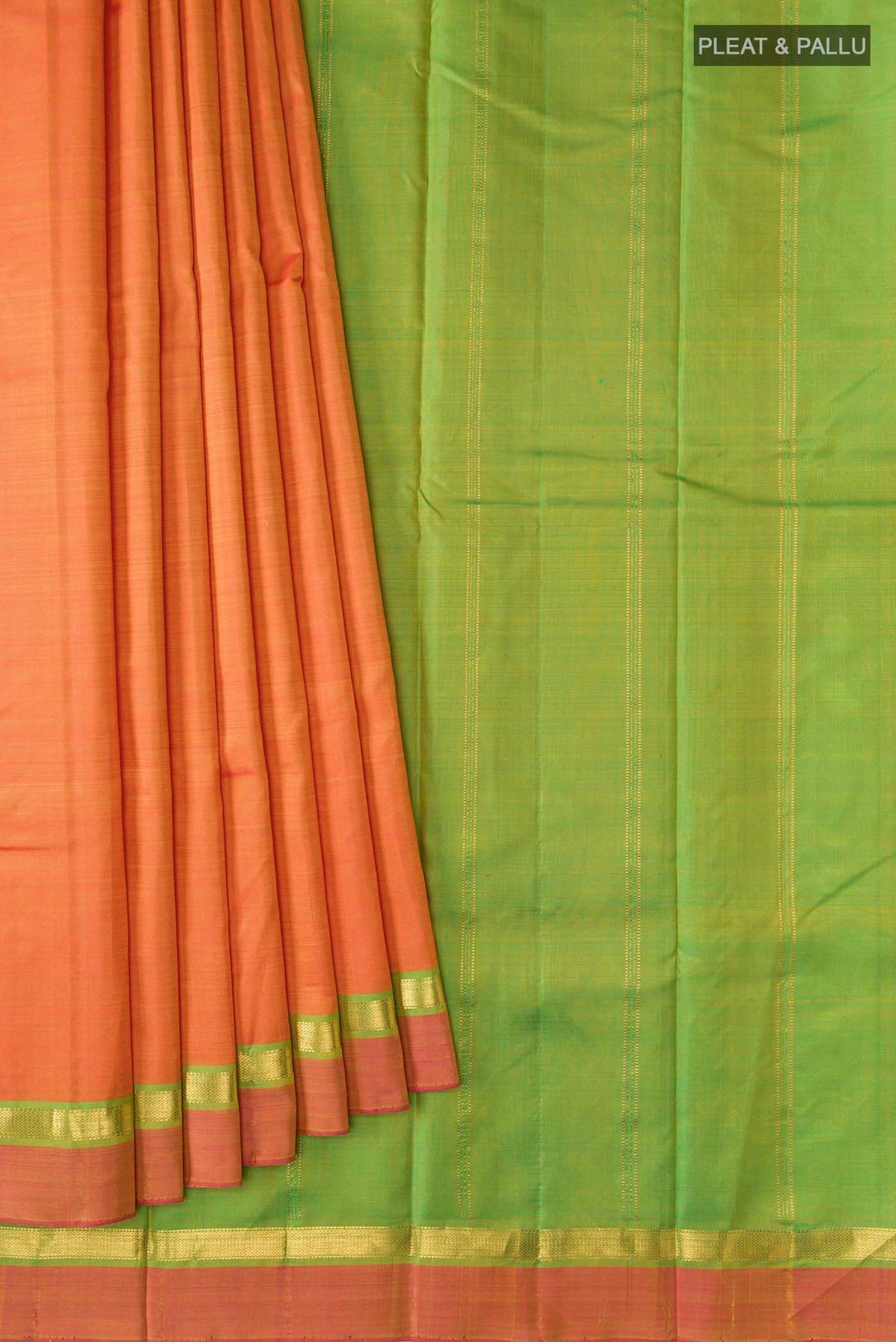 Pleats and pallu of Orange Kanchipuram Silk Saree with Plain Body and Zari Border