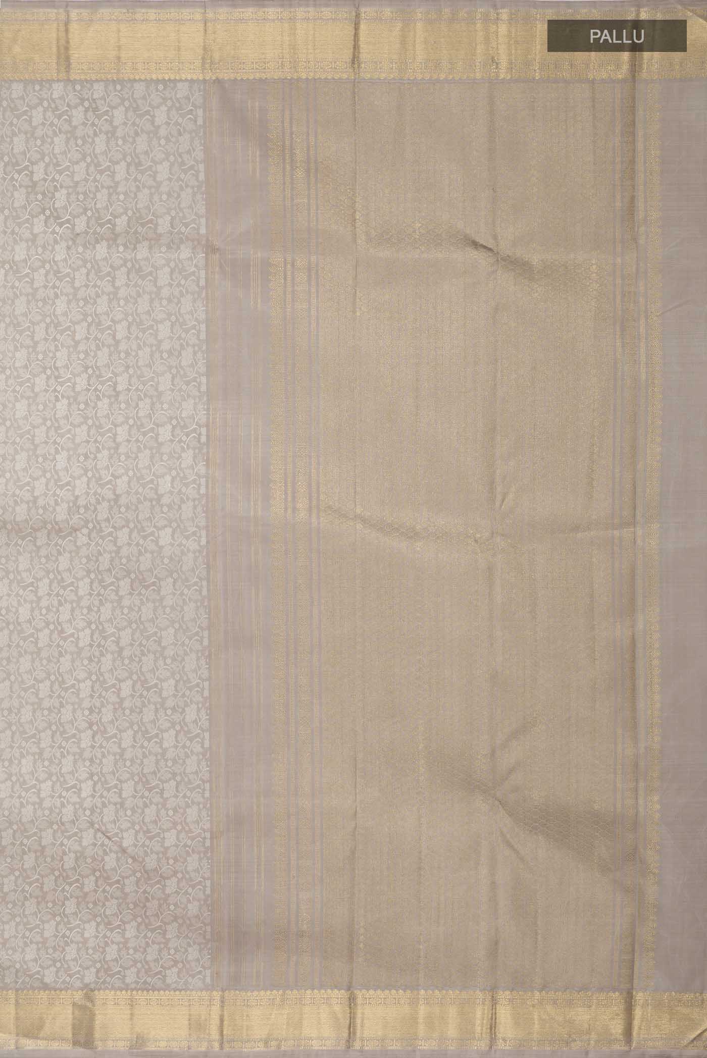 Close up image of the pallu of Grey Kanchipuram Silk Saree with Jacquard design on the body and Zari Border